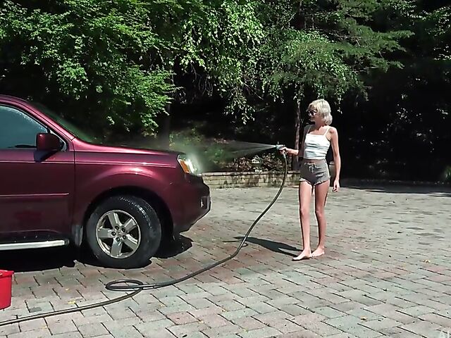 Skinny blonde Tallie Lorain spreading pussy outdoors during the car wash