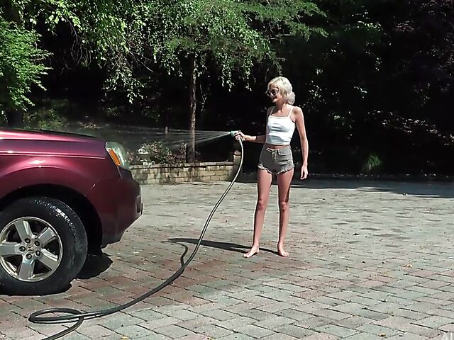 Skinny blonde Tallie Lorain spreading pussy outdoors during the car wash