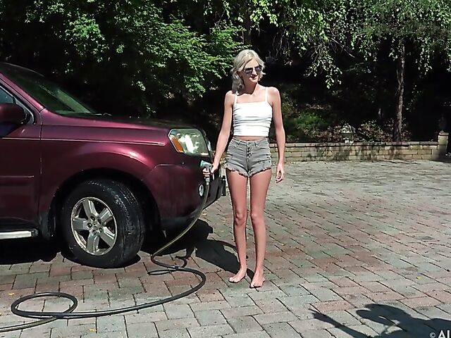 Skinny blonde Tallie Lorain spreading pussy outdoors during the car wash