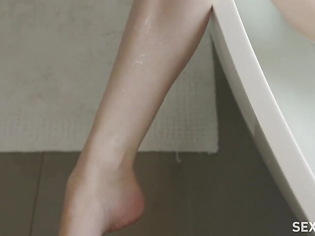 Erotic bathroom masturbation with a vibrator featuring Jillian Janson