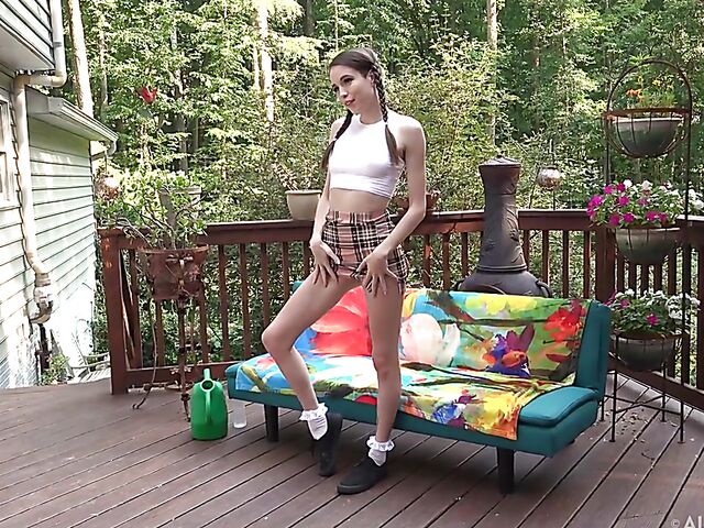 Shaved pussy insertion during Brooke Johnson's solo shoot outdoors