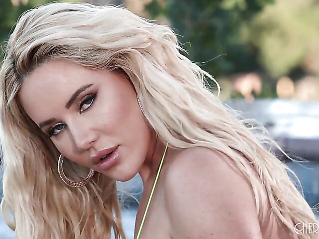 Big tits bikini blonde Savannah Bond shows off her goods and fucks her dildo in a jacuzzi