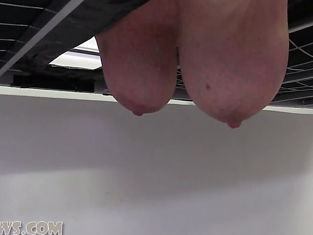 Ball gagged big breasted mature slave Manuela face down on the milking table