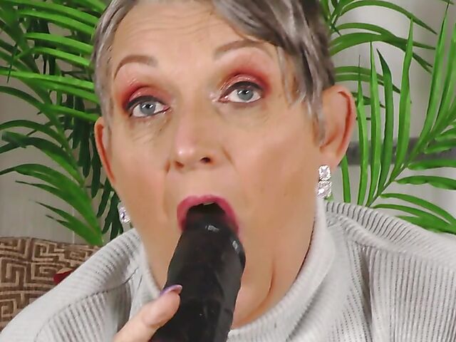 Short hair mature Marika fucks herself with a cucumber