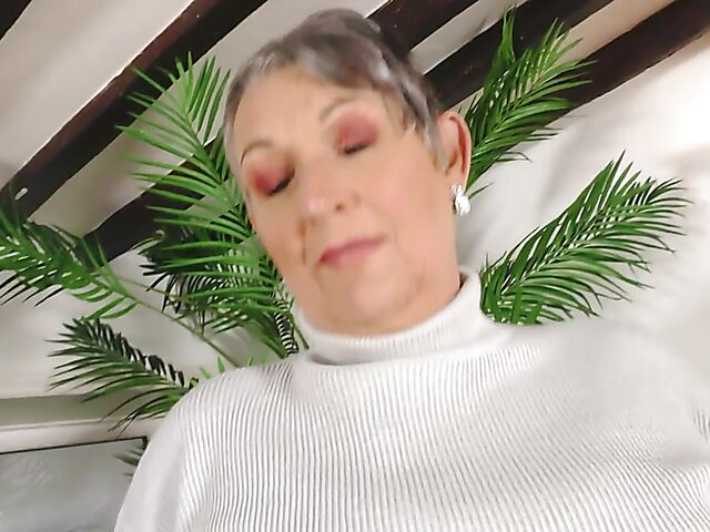 Short hair mature Marika fucks herself with a cucumber