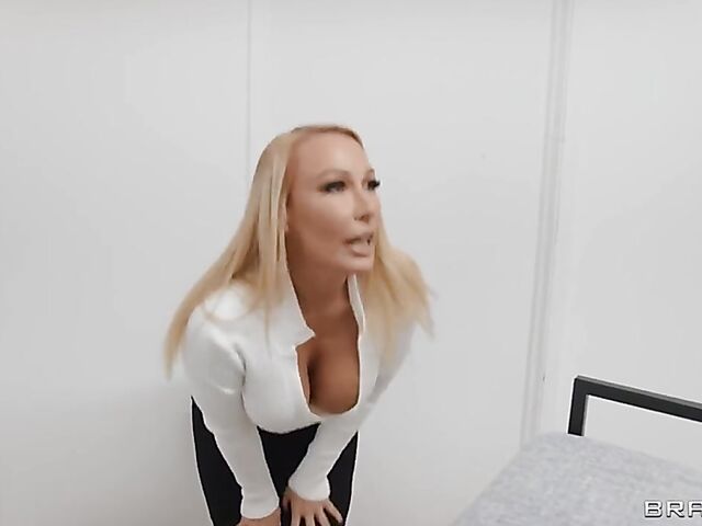 Well-endowed blonde MILF Mellanie Monroe gets horny on the stairs