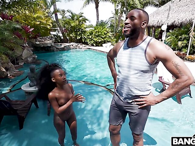 Petite ebony Mini Stallion takes a big black cock by the pool