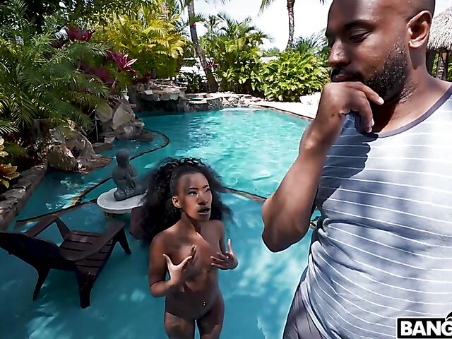 Petite ebony Mini Stallion takes a big black cock by the pool