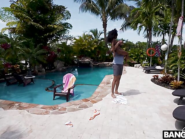 Petite ebony Mini Stallion takes a big black cock by the pool