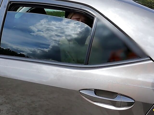 Young redhead Harper Red is naked in the car and needs help