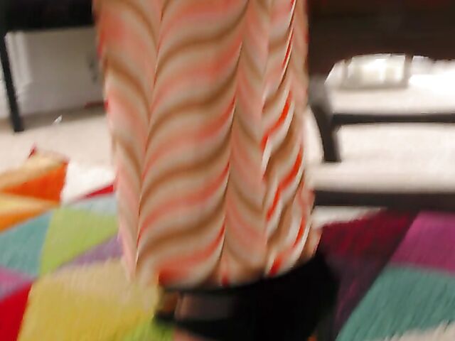 Shaved mature woman with glasses gets naked on the floor and pleasures herself