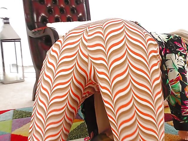 Shaved mature woman with glasses gets naked on the floor and pleasures herself