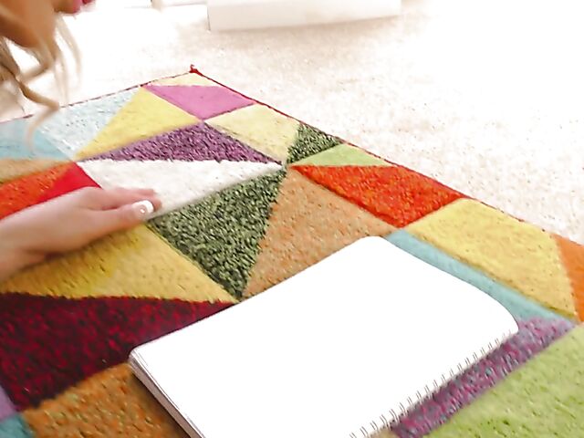 Shaved mature woman with glasses gets naked on the floor and pleasures herself