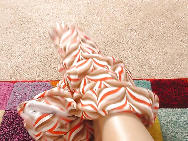 Shaved mature woman with glasses gets naked on the floor and pleasures herself