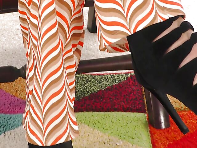 Shaved mature woman with glasses gets naked on the floor and pleasures herself