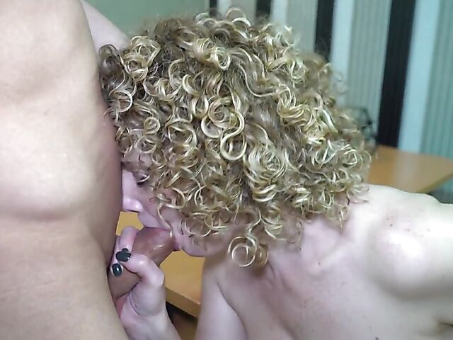 Curly-haired busty MILF boss Merce fucks a young guy at work