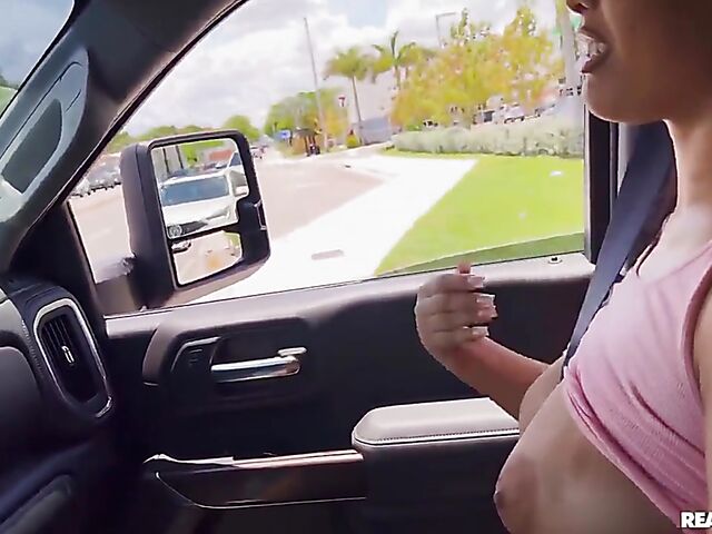 Big ass ebony girl with natural tits Ariel Pure gets it started in the car