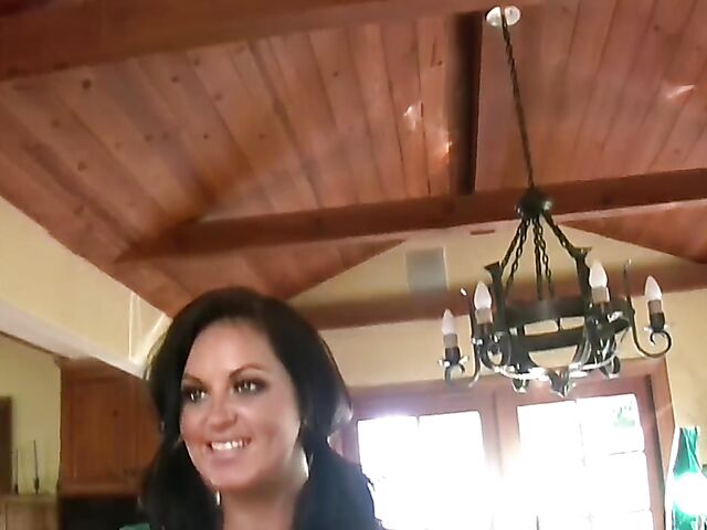 Busty brunette Sarah Randall uncovers her massive boobs