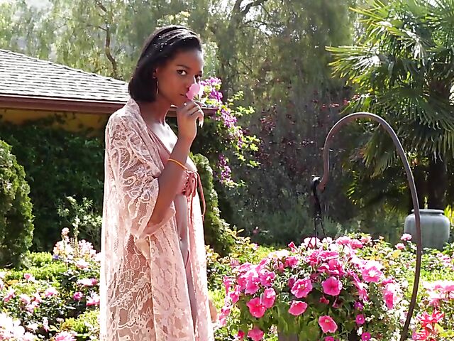 Ebony beauty Luci Lane posing naked in the garden