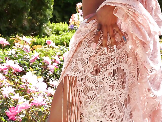 Ebony beauty Luci Lane posing naked in the garden