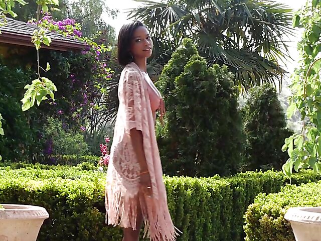 Ebony beauty Luci Lane posing naked in the garden