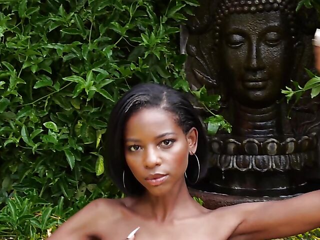Ebony beauty Luci Lane posing naked in the garden