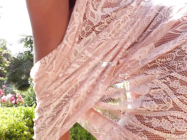 Ebony beauty Luci Lane posing naked in the garden