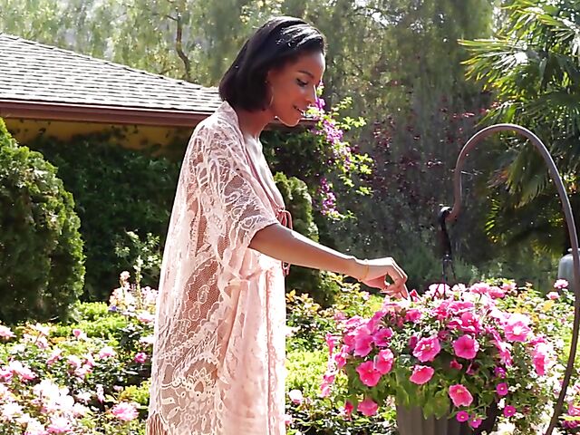 Ebony beauty Luci Lane posing naked in the garden