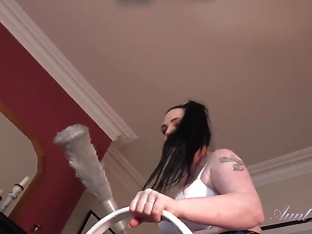 Mature brunette in a mini skirt Kjirsten masturbates while cleaning the room