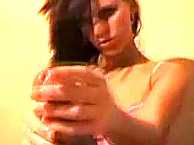 Brunette gives double handed handjob to her boyfriend