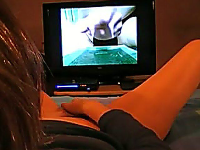 Amateur girl watching porn and stroking her pussy