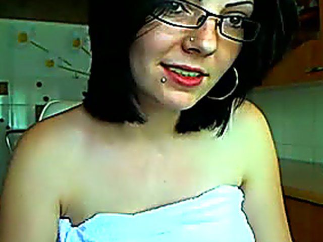 Glassed brunette dildoing her snatch in the kitchen