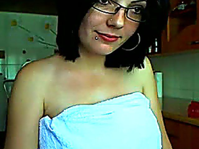 Glassed brunette dildoing her snatch in the kitchen