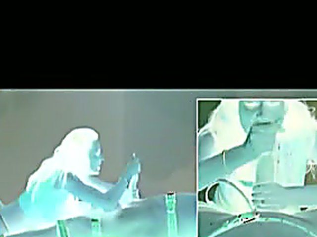 Long haired brunette in thong jerks guy off