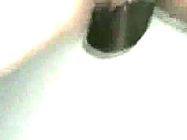 Mature woman sucks cock through a glory hole