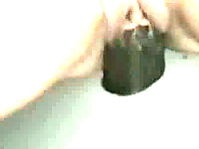 Mature woman sucks cock through a glory hole