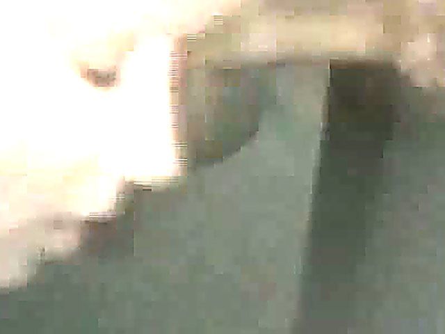 Mature woman sucks cock through a glory hole