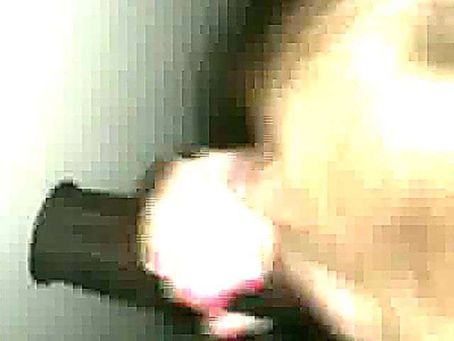 Mature woman sucks cock through a glory hole