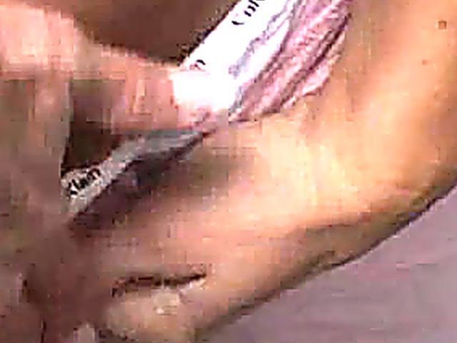 Muscle babe watches herself fingering her pussy