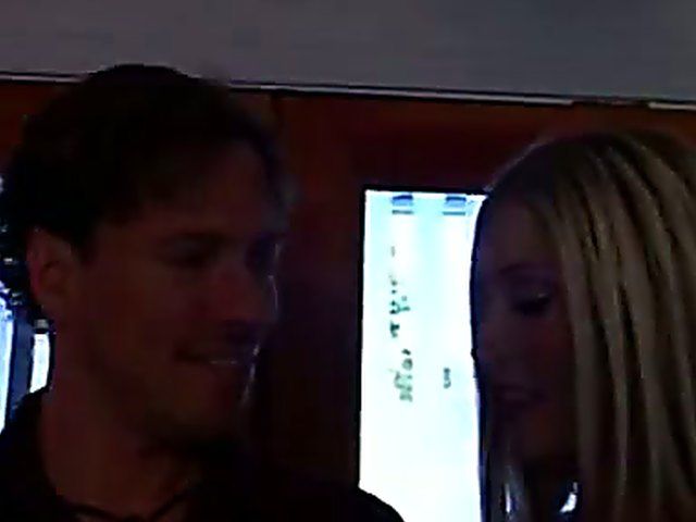 Sexy blonde enjoys playing with two big cocks