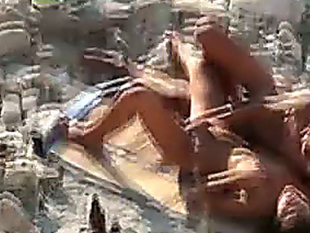 Horny couple have sex outdoors on the beach