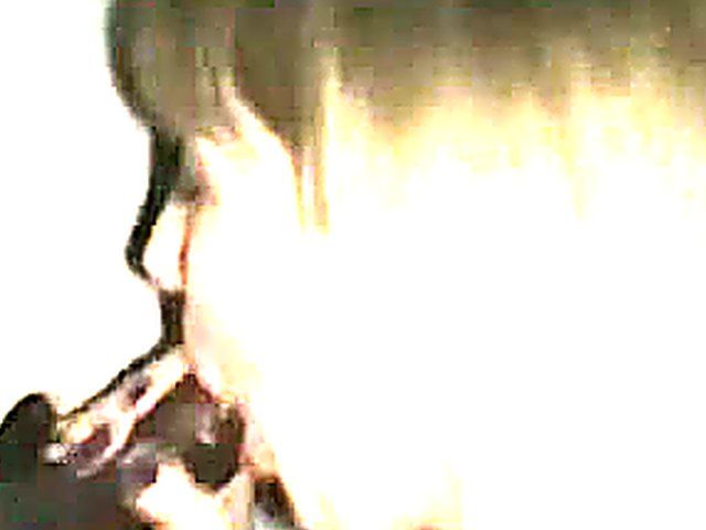 Blonde slut sucks black cock in a gloryhole