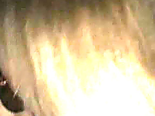 Blonde slut sucks black cock in a gloryhole