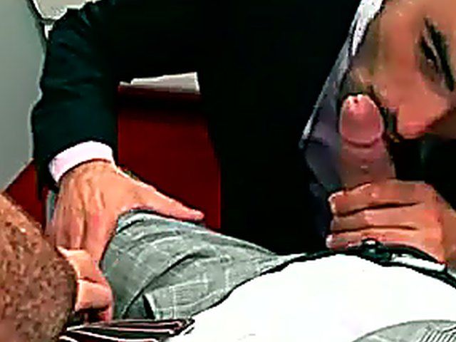 Two muscle men in suits have anal sex