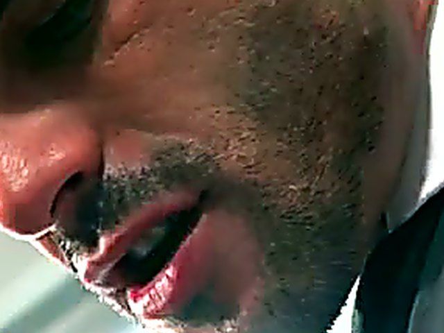 Two muscle men in suits have anal sex