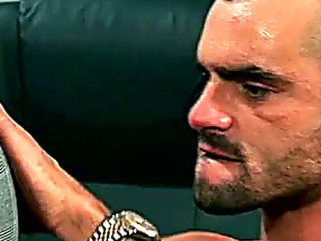 Two muscle men in suits have anal sex