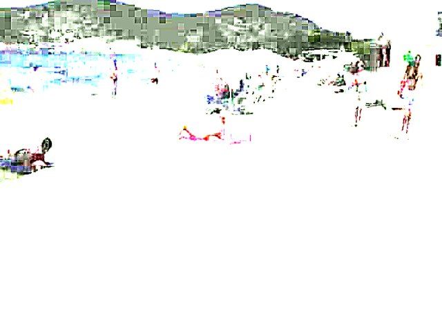 Tanning MILF on beach is exhibitionist