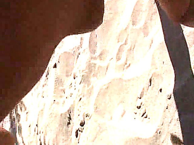 Tanning MILF on beach is exhibitionist