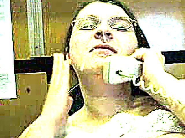 A MILF takes a call and a load 