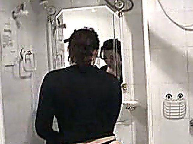 Hot brunette gets kinky in the shower